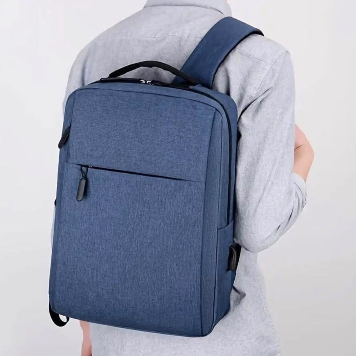 Blue water-resistant laptop backpack 15.6 inch worn on the back